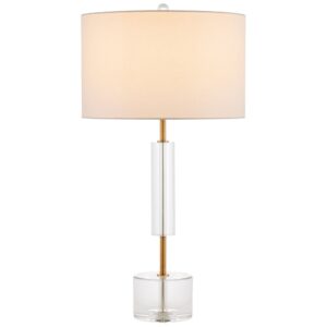 Antique crystal table lamp with gold base reflecting prismatic light in a luxury bedroom
