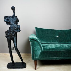 Resin sculpture decor ideas for home — meadow ombre ceramic lamp beside a high-quality resin figurine on a transitional living room console