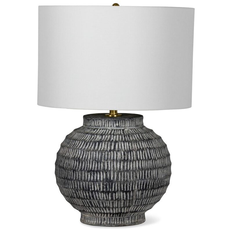 Famous garden sculptures — adobe brown ceramic lamp on a covered garden terrace beside a cast stone garden sculpture