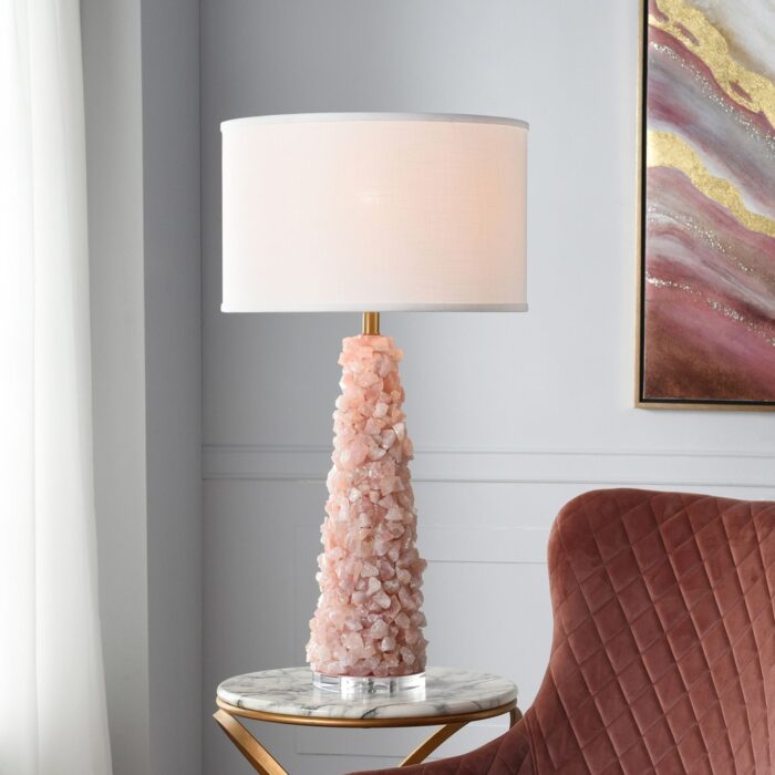 Crystal table lamps on a dining room sideboard — matched pair flanking a gold mirror above a dark sideboard