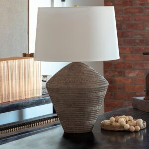 Unusual sculptural black metal cage lamp shade on a ceramic table lamp base