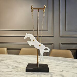 Marble sculpture display — aged brass ceramic lamp beside a marble bust on a console at standing eye level in a formal transitional room