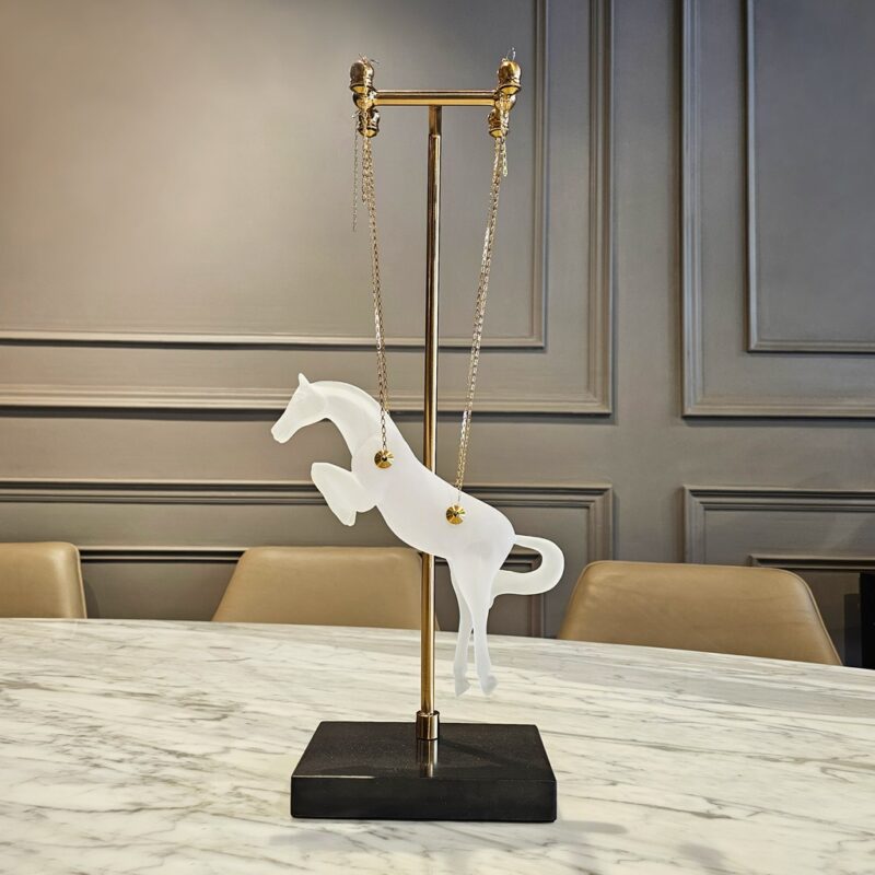 Glass sculpture art for modern interiors — cobalt glass lamp beside a hand-blown glass sculpture on a contemporary console