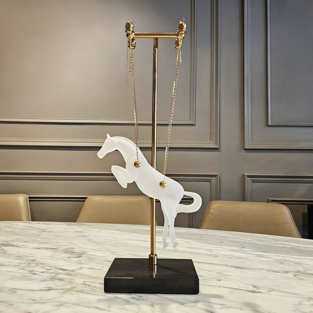 Glass sculpture art for modern interiors — cobalt glass lamp beside a hand-blown glass sculpture on a contemporary console