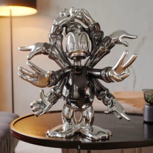 Marble sculpture home decor — aged brass granite lamp beside a marble figurine on a transitional living room console