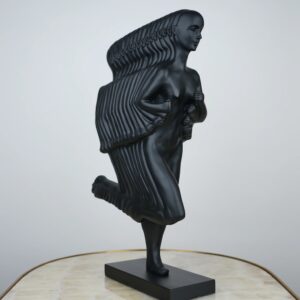 Choosing sculpture material for home — bronze lamp beside bronze-finish sculpture showing warm material continuity in a traditional transitional room
