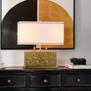 Amethyst and violet stained glass table lamp casting purple light on a bedroom nightstand at night