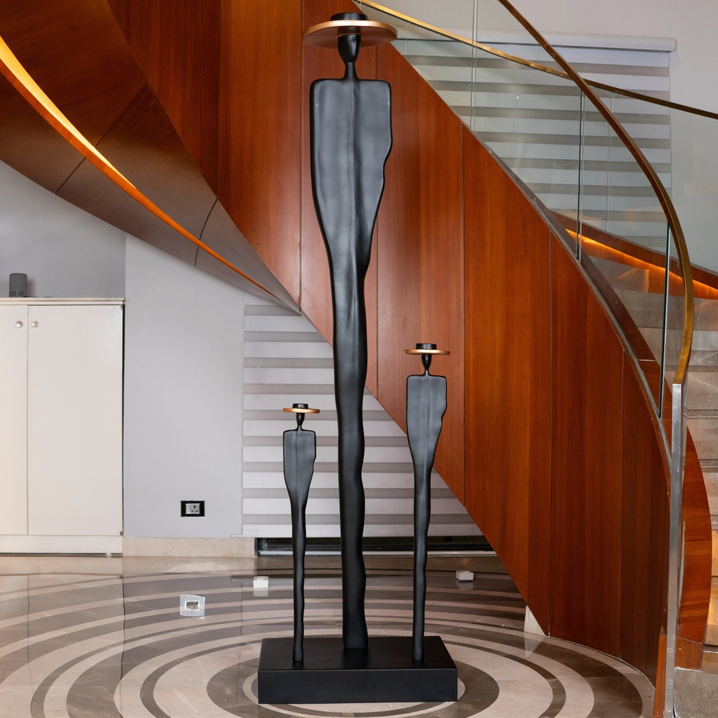 Bronze sculpture for home decor ideas — bronze accent lamp beside a cast bronze animal sculpture on a transitional console