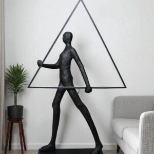 Resin sculpture for home — natural beige lamp beside a high-quality polyresin bronze-finish figurine on a living room console