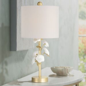 Crystal table lamp with white empire shade on a cherry wood end table in a traditional living room