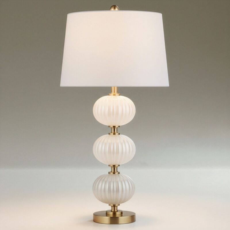 Glass base table lamp in cobalt blue on a warm walnut nightstand — jewel-toned statement piece for a bedroom