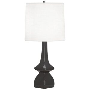 Tiffany style table lamp in lavender and violet stained glass on a traditional side table with warm wood