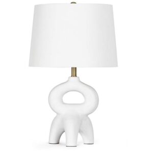 Before and after — oversized table lamp overwhelming a small nightstand versus correctly proportioned mini lamp