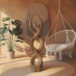Styling different sculpture styles at home — warm granite ceramic lamp on a console beside a classical piece, creating the primary display zone in an eclectic room
