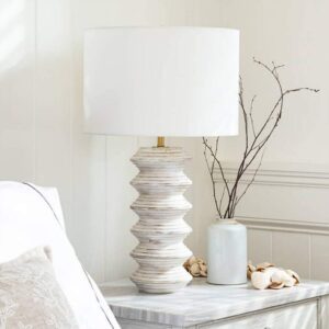Tiffany style dining room table lamp — stained glass shade casting amber light in a warm traditional dining room