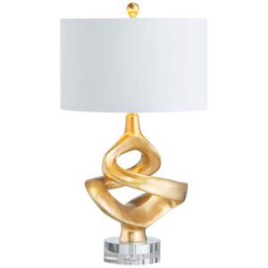 Traditional Tiffany style table lamp casting jewel-toned light in a warm-toned study