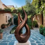 Large outdoor sculpture ideas for garden design — bronze lamp on a covered garden terrace beside a large-scale outdoor sculpture