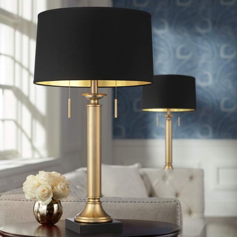 Table lamp with USB port on a nightstand — artisan ceramic base with built-in USB charging beside a phone and book