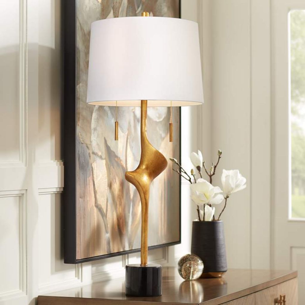 Mauve table lamp on a natural linen nightstand — the subtle warm color trend for bedrooms in 2025-2026