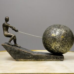 Bronze sculpture for home decor ideas — bronze accent lamp beside a cast bronze animal sculpture on a console in a transitional living room