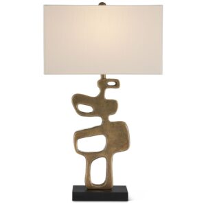 Brass table lamp beside a gold-framed mirror — warm metallic color coordination in a hallway
