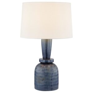 Fish sculpture — cobalt glass table lamp on a coastal console table beside a bronze dolphin sculpture in a light-filled coastal living room