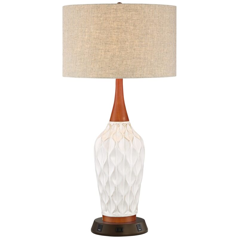 White ceramic table lamp on a natural wood nightstand — the bedroom essential that suits every interior style