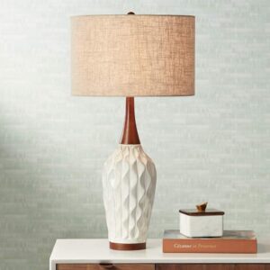 Table lamp cleaning kit — microfibre cloths, soft brush, and mild soap on a wooden surface