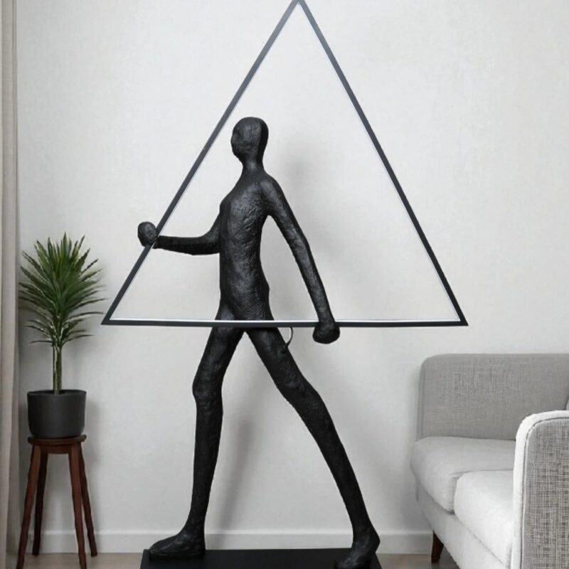 Sculpture home decor trends for 2025 — gold leaf statement lamp in a room designed around the 2025 principle of considered permanence