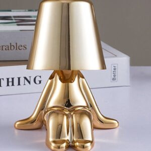 Sculpture for bedroom wellness — matte black lamp as minimal presence allowing crystal and organic form sculpture to read as primary visual interest at the bedside