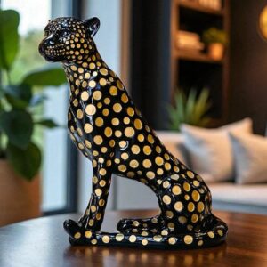 Outdoor living sculpture trends for garden and patio — bronze accent lamp in a covered garden room connecting outdoor sculpture to the adjacent interior