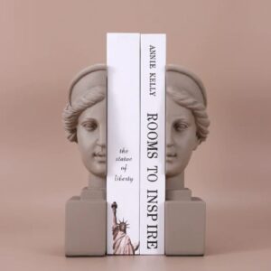 Rodin sculpture style ideas for home inspiration — Affogato brass ceramic lamp on a study console beside a Rodin-tradition bronze reproduction
