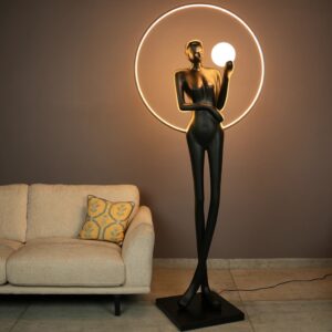 Biophilic design sculpture for home interiors — sage green ceramic lamp as biophilic art object in a nature-connected interior with plant, stone, and organic material