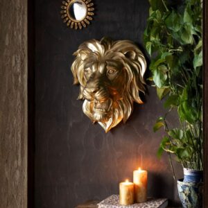 Wall sculpture art ideas for living room decor — Adeline gold petal lamp on a console beneath a metal wall sculpture creating a three-dimensional display in a transitional living room