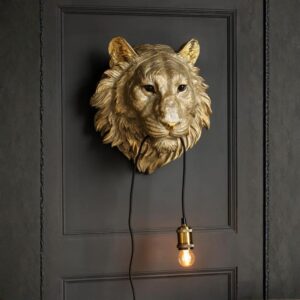 Large wall sculpture living room — slim modern accent lamp on a console beneath a large metal wall sculpture installation in a contemporary living room