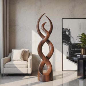 Entryway sculpture for home — bronze accent lamp on an entry hall console beside a primary statement sculpture creating the home's first design impression
