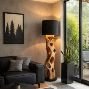 Small sculpture for coffee table display — natural beige side table lamp creating warm material continuity with a small bronze sculpture and art book stack on the adjacent coffee table