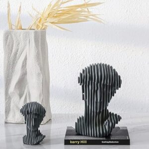 Abstract art sculpture ideas for home interior design — Aarna matte black lamp on a console beside an abstract ceramic sculpture in a contemporary living room