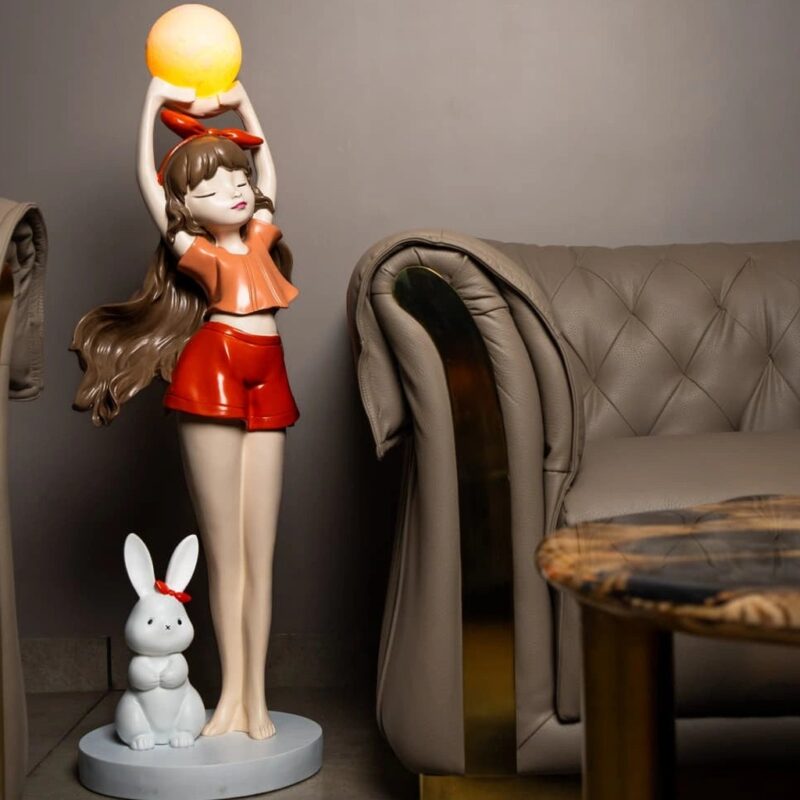 How to display sculpture at home like a professional — meadow ombre lamp beside a sculpture showing the lamp-anchor professional composition