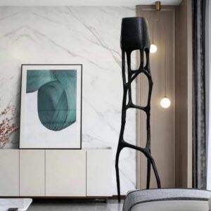 Sculpture techniques guide for beginners — granite ceramic lamp on a studio worktable beside clay sculpting tools and reference books