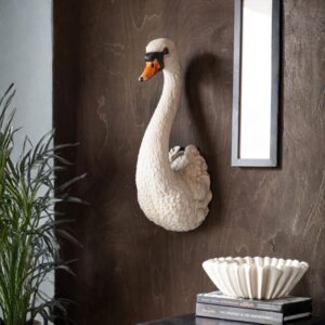 Sculpture finishing techniques for smooth professional results — slim modern accent lamp in a studio where finished sculptures at different surface quality stages are evaluated
