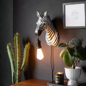 How to repair damaged sculpture at home — adobe brown lamp beside a restored ceramic sculpture that has been repaired and color-matched for home display