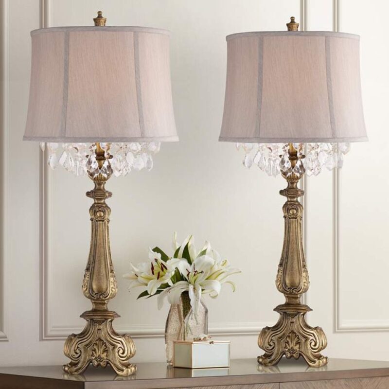 Art deco table lamps — Zeus gold leaf lamp showing vertical proportion, material drama, and geometric quality