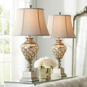 Farmhouse table lamps — adobe brown chisel ceramic lamp in a warm farmhouse room with natural wood surfaces and linen textiles
