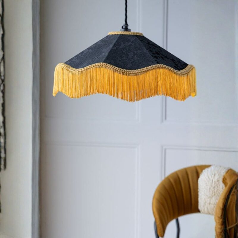 Modern chandeliers — black and gold tassel ceiling light creating contemporary glamour with textile movement