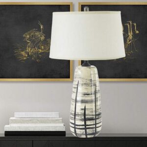 Table lamps for bedroom — pale blue ceramic at correct nightstand height in a calm restful bedroom with neutral bedding