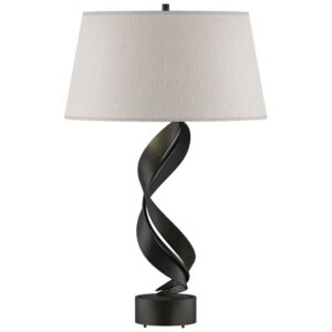 Plug in table lamps — natural beige ceramic plug-in lamp in a rental apartment showing the correct portable lighting investment