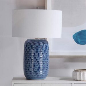 Small space table lamps studio — Aarna matte black lamp on a studio sofa end table showing strong visual presence with minimal footprint