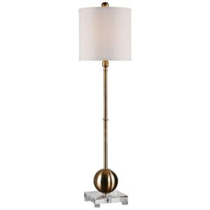 Coastal bedroom table lamps — natural beige lamp on a beach house nightstand creating warm light in a coastal bedroom with white linen bedding