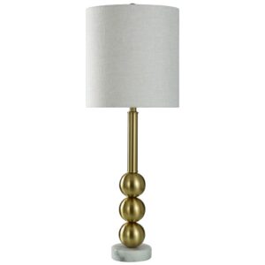 Gold table lamps — Zeus gold leaf lamp in a formal living room showing the warm gold material quality that distinguishes tasteful from excessive